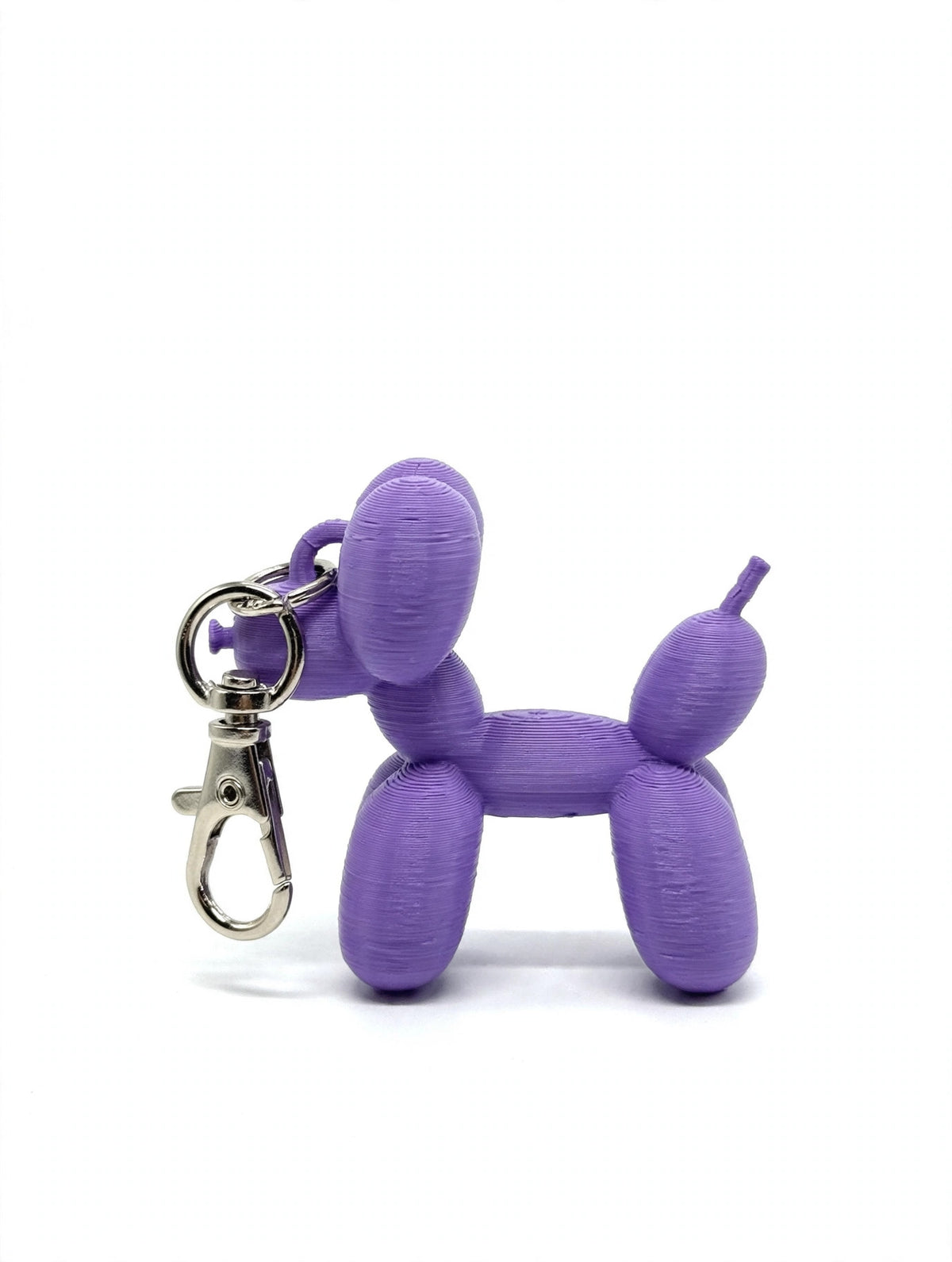 3D printed balloon dog keychain, purple, white background