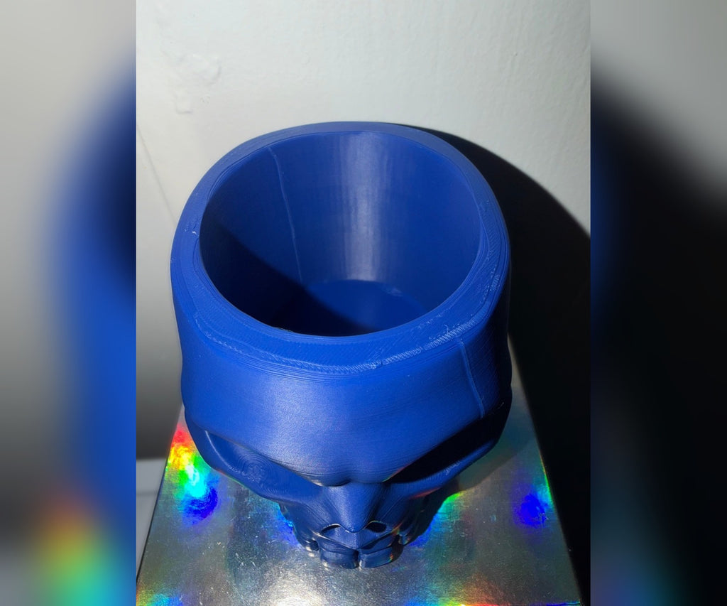 Blue 3D printed skull bowl, top view into the bowl